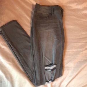 Tilly’s grey ripped IBIZA skinny jeans.